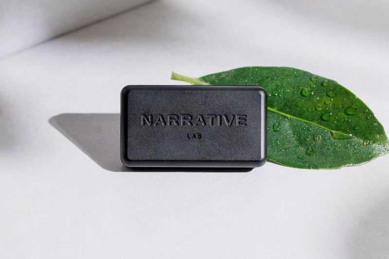 Narrative Lab Fine Fragrance Solid Fragrance, Renew Solid Fragrance, No parabens, no phthalates, no alcohol, Plant-based wax that is vegan friendly. Smells like a light citrus burst with fresh green dew accord sitting on a driftwood base.